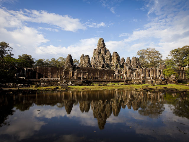 Smiling Stone Face of Bayon Temple at Angkor in Cambodia